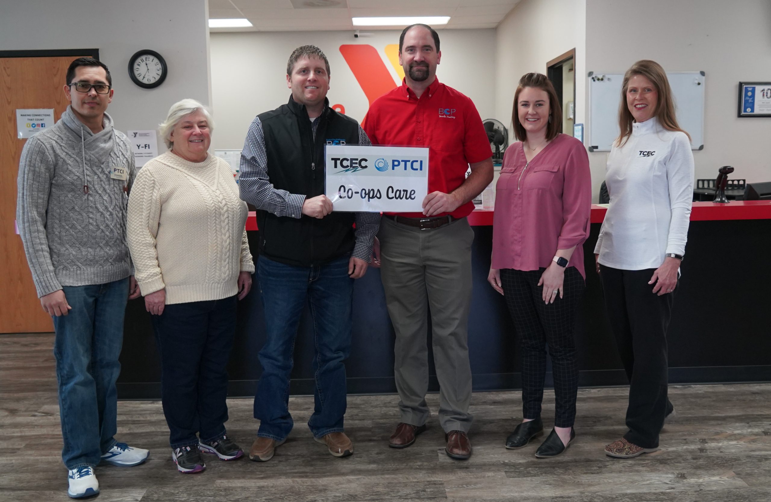 Co-ops Care: PTCI and TCEC come together to donate $5,000 to local Y